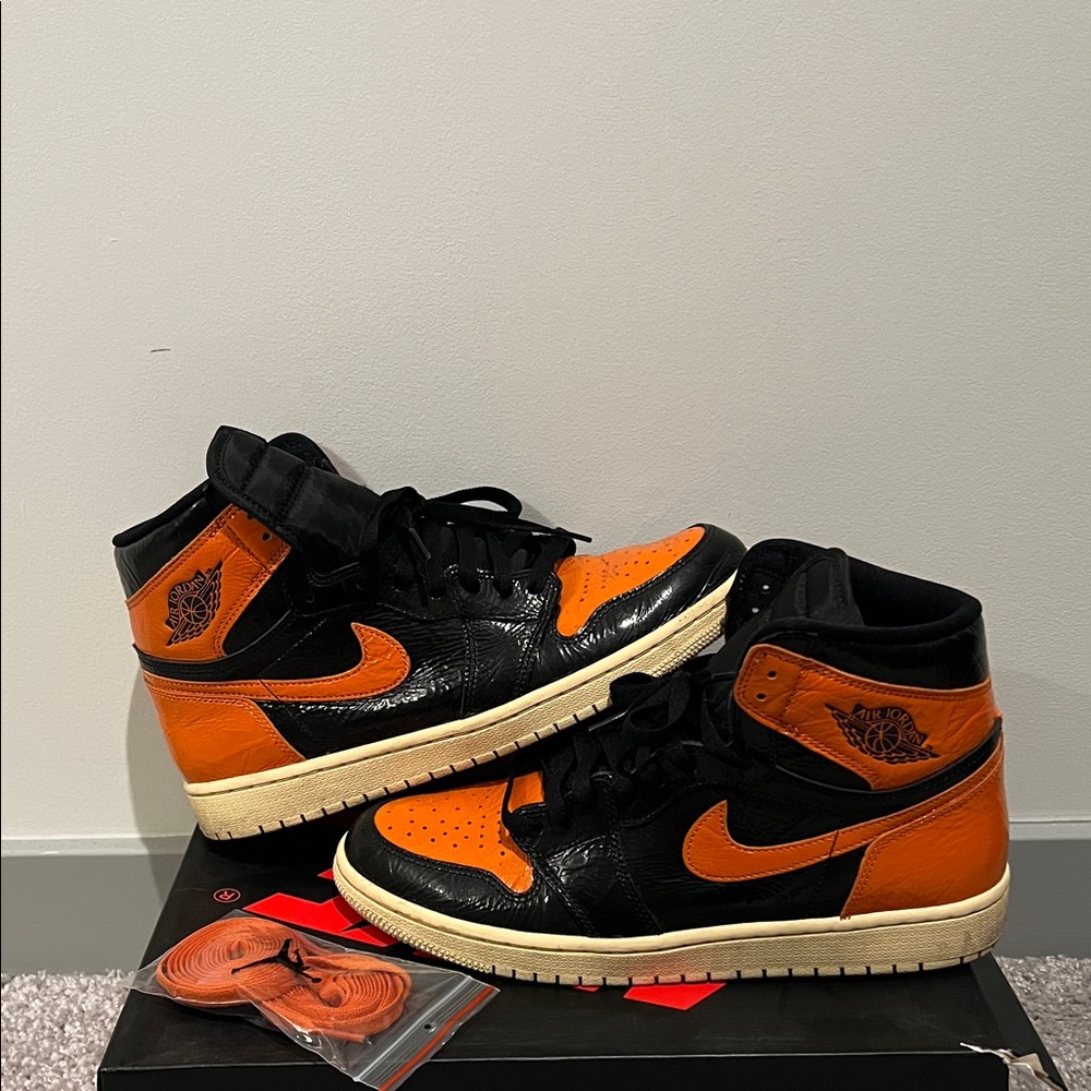 Jordan High-Top Sneakers in Black and Orange